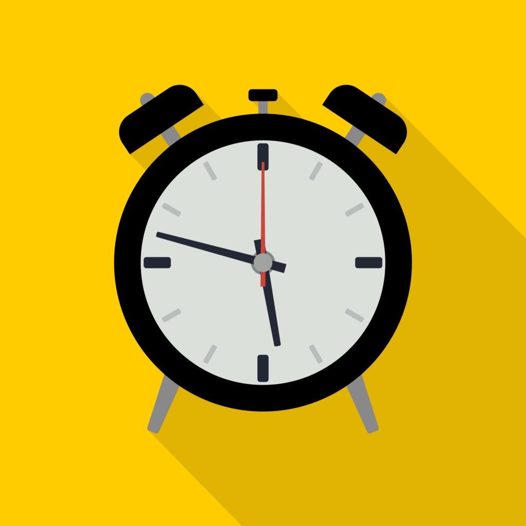 Illustration of a black-framed vintage alarm clock with two bells, showing the time as 10:10. Set against a bright yellow background with a long shadow extending to the right, it captures the nostalgia of classic design while embracing a timeless user experience.