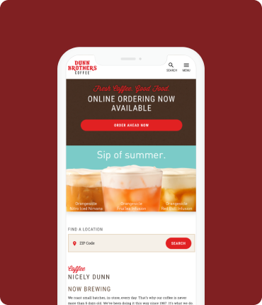 The smartphone showcases Dunn Brothers Coffees website with the Sip of Summer theme, emphasizing user experience. It features online ordering and vivid images of refreshing beverages, along with a handy search option for store locations to enhance customer experience.