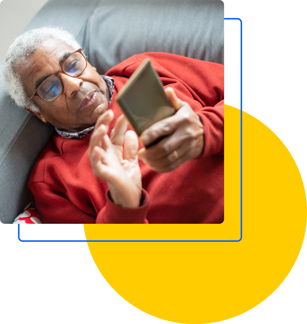 Graphic consisting of an image of a person lying down using their mobile device overlaid on a blue square outline and a yellow circle