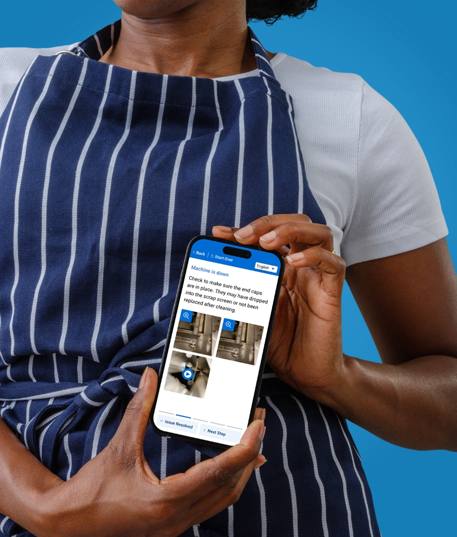 Closeup of a person wearing an apron and accessing product customer service support on a mobile device.