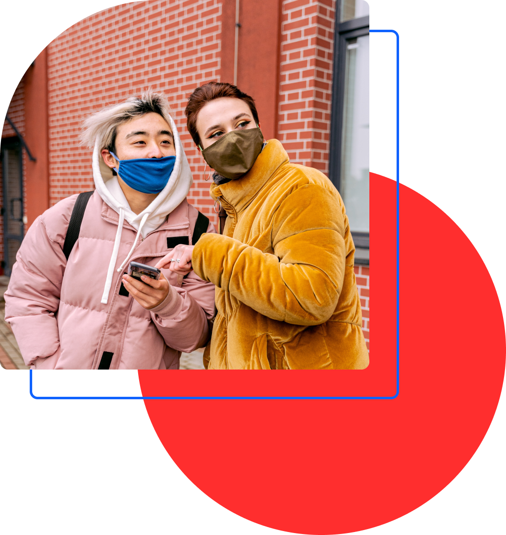 a red cirle and blue square are layered under an image of two masked people looking at a mobile phone.