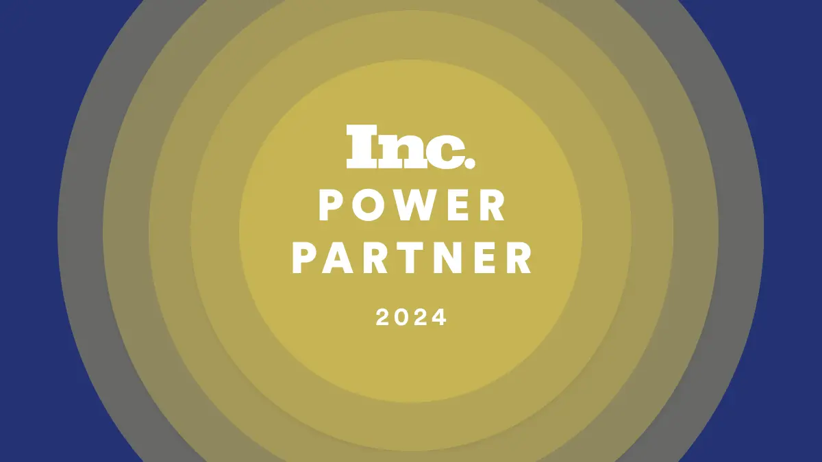 A layered circle graphic with shades of blue and gold, reminiscent of clockwork precision. The text Inc. Power Partner 2024 is prominently displayed at the center, symbolizing a seamless user experience.